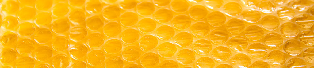 Yellow bubble wrap foil on yellow background