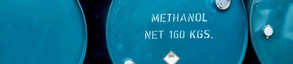 Stack of blue methanol or methyl alcohol drums.