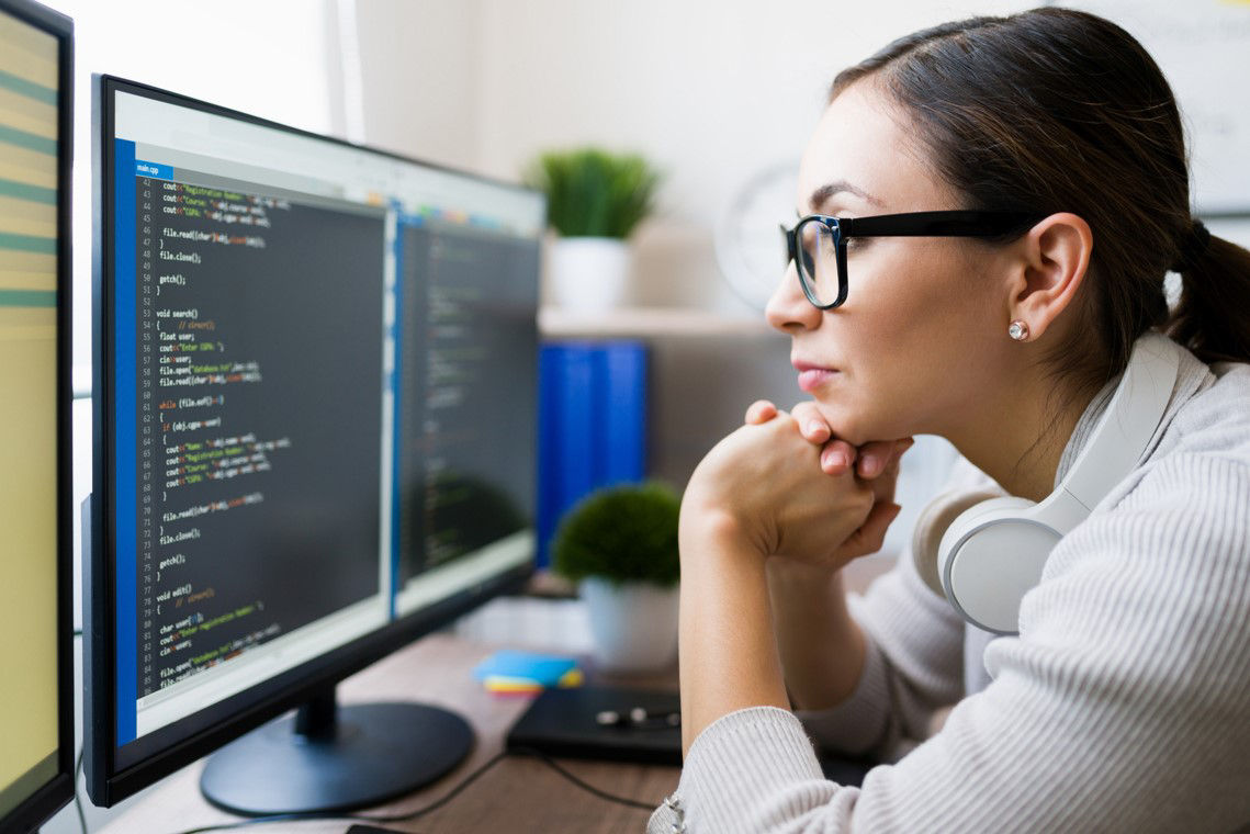 Girl leaning forward to look at screen