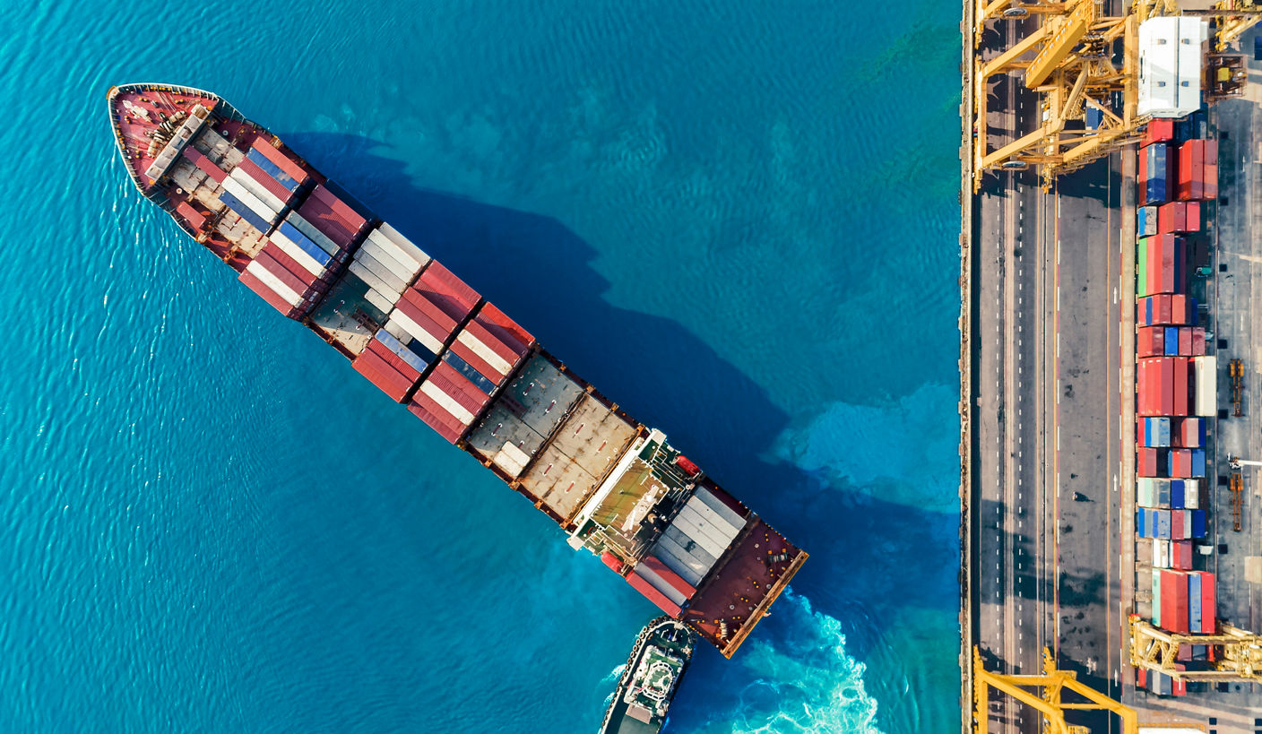 aerial top view container ship crane Lifting container for Logistic by sea in warehouse