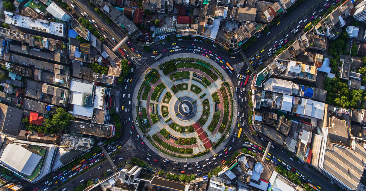 Aerial view of city with small cars