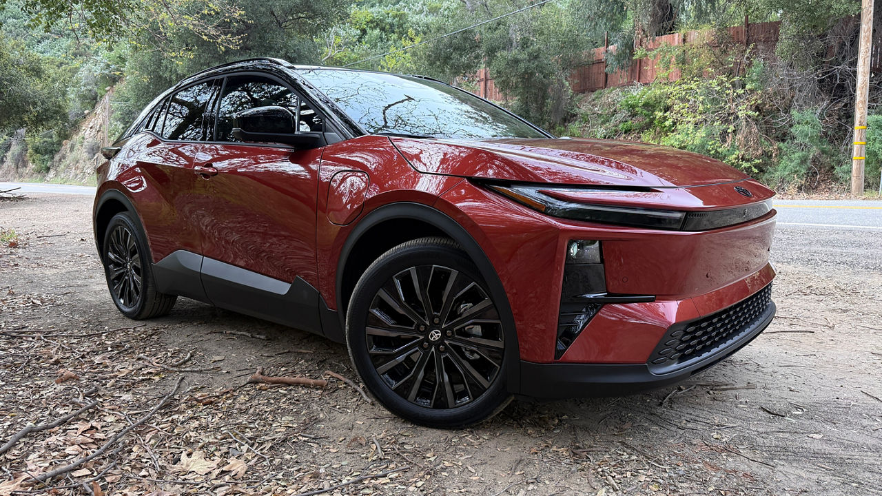 Side view of a red Toyota C HR